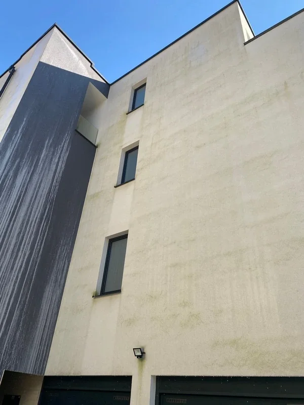 Residential building facade with traces of dirt before drone washing