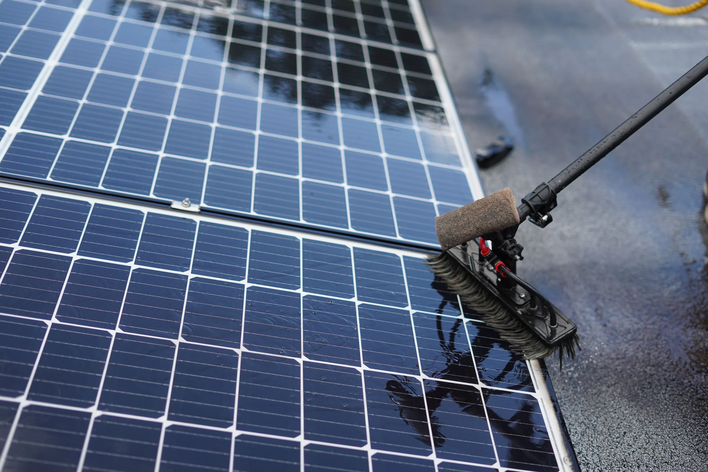 Washing solar panels with a soft brush and water, without aggressive agents