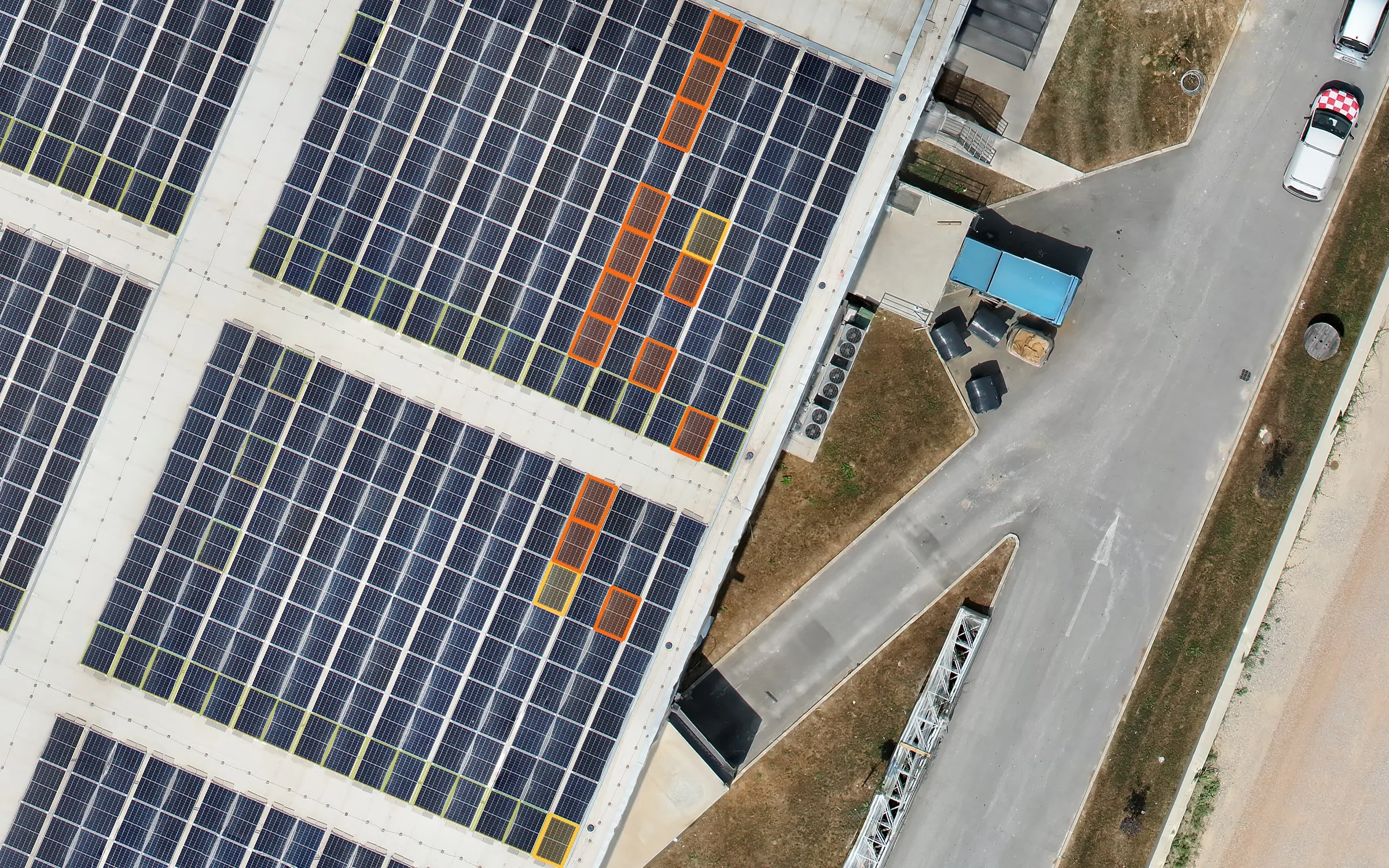 Rooftop solar plant with panels marked by Solar AI according to finding priority